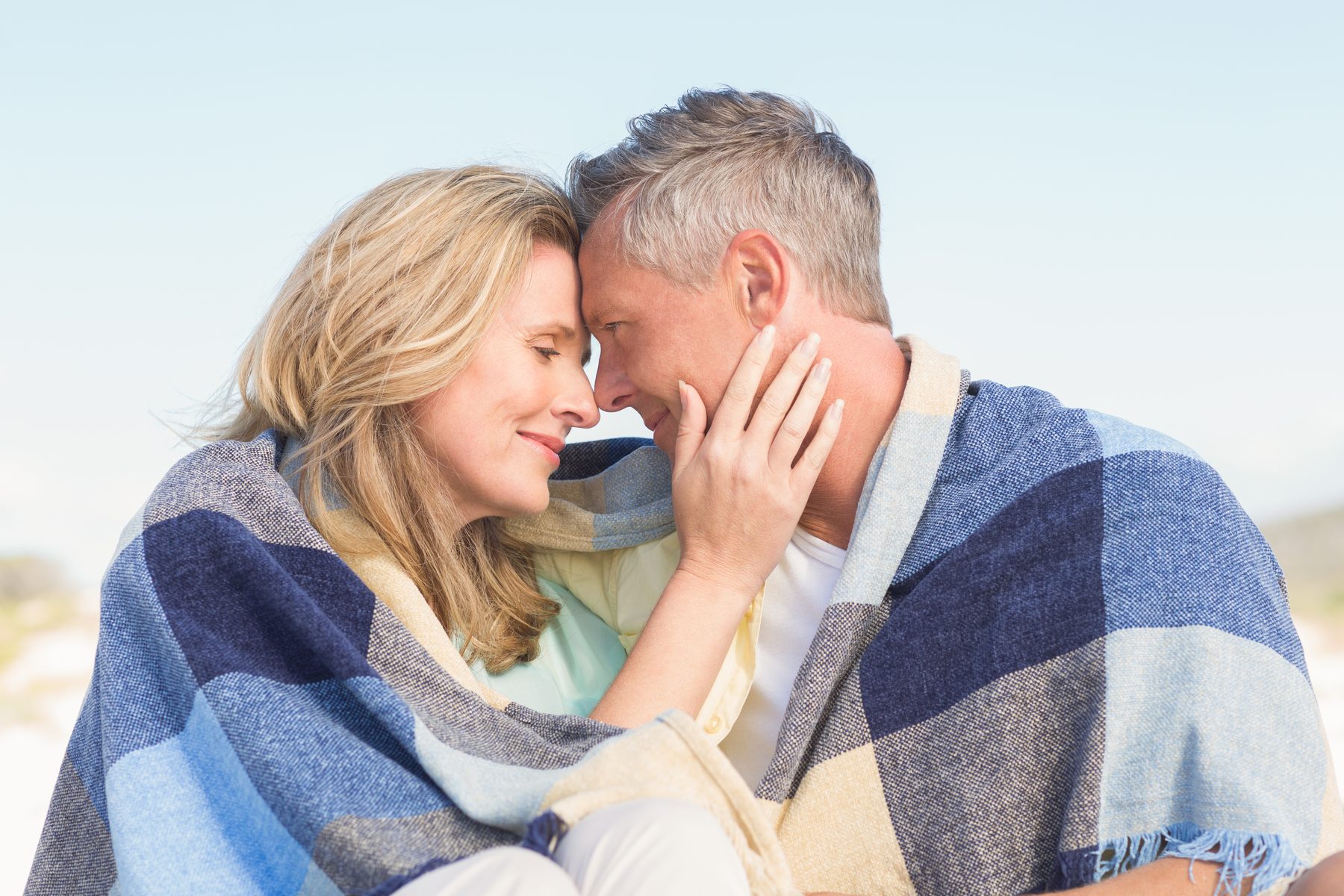 A mature couple sharing a quiet affectionate moment