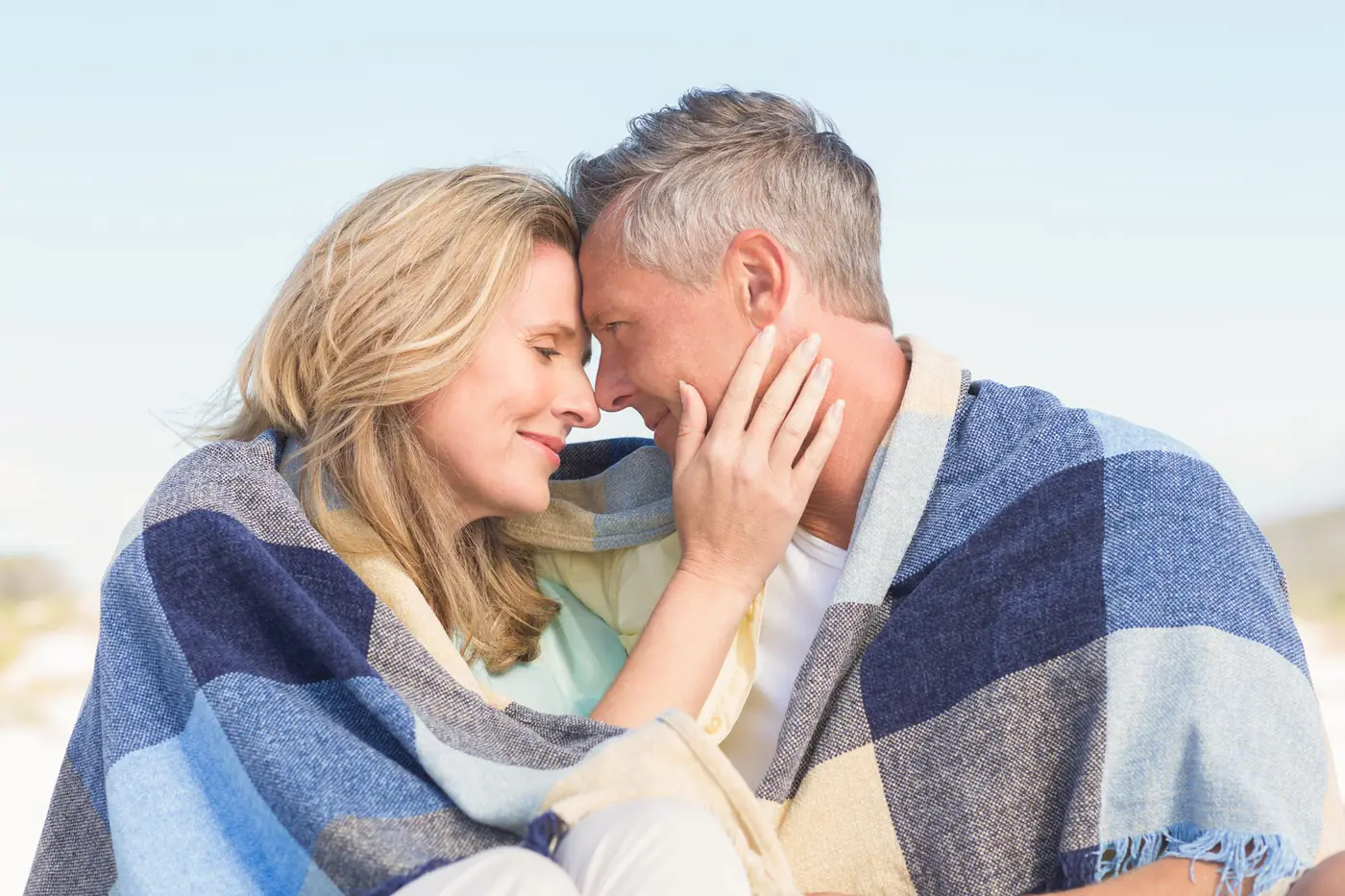 A mature couple sharing a quiet affectionate moment