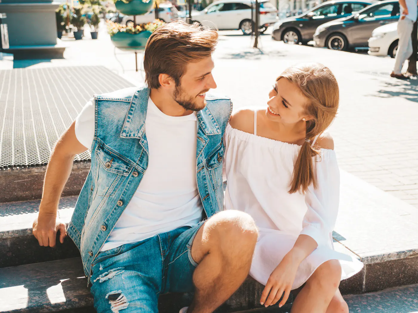 A smiling couple talking together outdoors